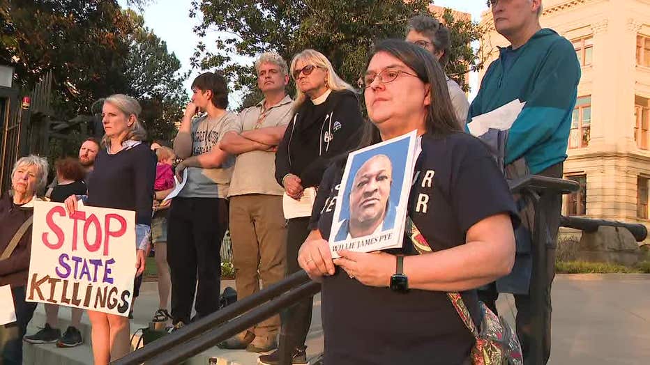 Protesters in front of the Georgia Capitol call for a stay of execution for Willie Pye on March 20, 2024.