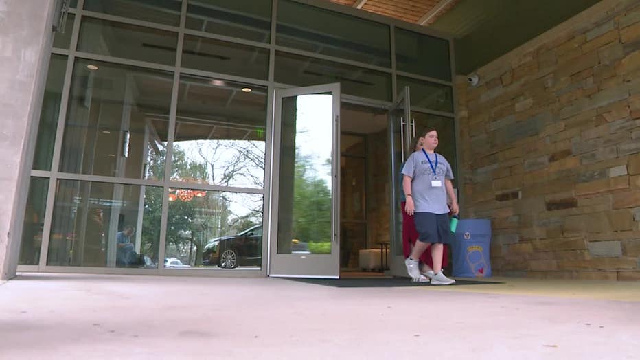 Stone Gilley walks out of Children's Healthcare of Atlanta after a session of his outpatient rehabilitation program.