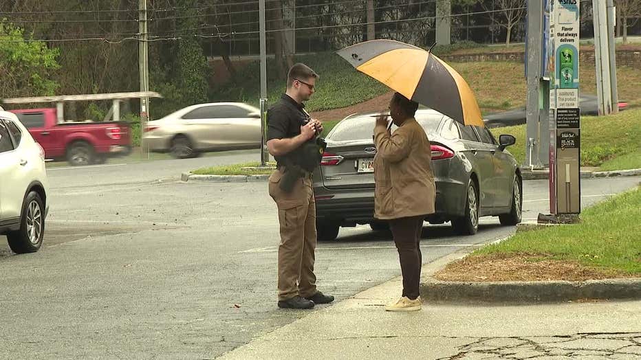 Detectives investigate the death of a 43-year-old man found shot to death in a car along Powers Ferry Road on March 22, 2024.