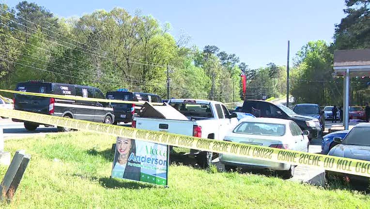 DeKalb County police investigate a deadly shooting along Wesley Chapel Road at the corner of Rainbow Road on April 5, 2024.
