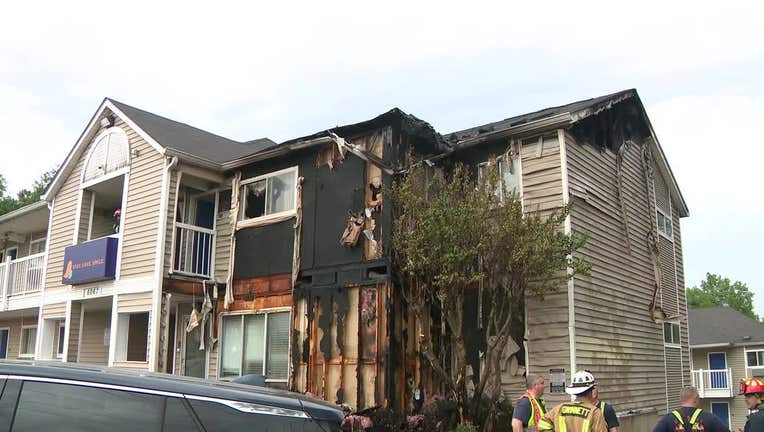 Gwinnett County firefighters surround the InTown Suites Extended Stay along Buford Highway, just north of Jimmy Carter Boulevard, in Norcross on April 17, 2024.