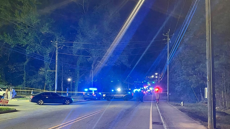 DeKalb County police officers block the 2100 block of Flat Shoals Road after a high-speed chase in pursuit of a carjacked vehicle on April 4, 2024.