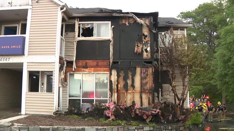 Gwinnett County firefighters surround the InTown Suites Extended Stay along Buford Highway, just north of Jimmy Carter Boulevard, in Norcross on April 17, 2024.