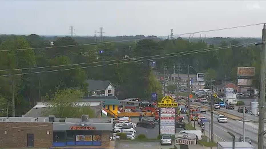 Gwinnett County firefighters surround the InTown Suites Extended Stay along Buford Highway, just north of Jimmy Carter Boulevard, in Norcross on April 17, 2024.