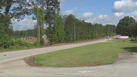 2 people, including child, injured after car crashes into bus in Spalding County