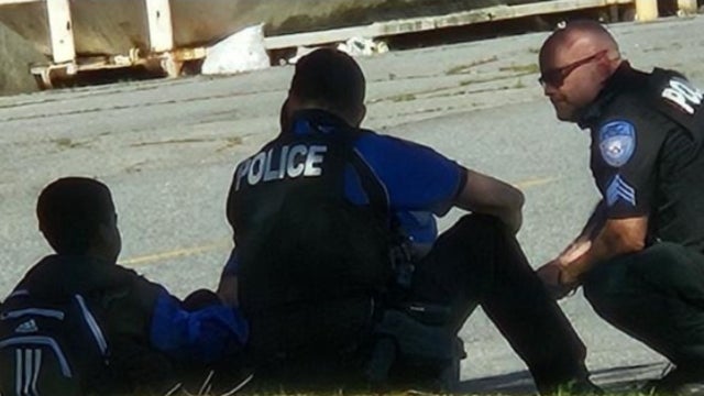 Alpharetta officers praised for compassionate handling of child in crisis on busy roadway