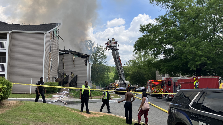 Firefighters battle a blaze at a DeKalb County apartment complex which left one person dead on May 5, 2024.