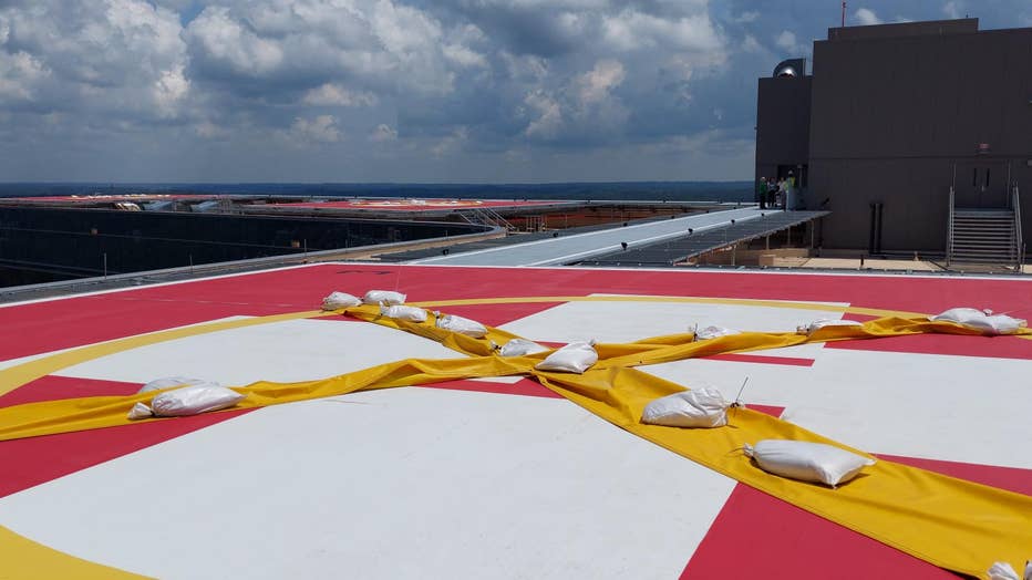 A large helipad overlooks the Atlanta skyline. 