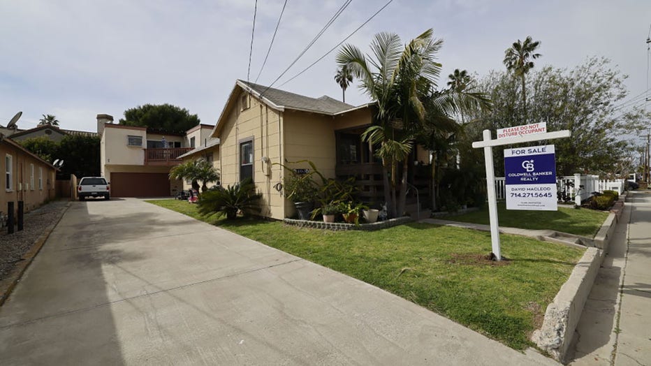 FILE - A home for sale sign in front of a house in Huntington Beach on March 15, 2024. (Allen J. Schaben / Los Angeles Times via Getty Images)