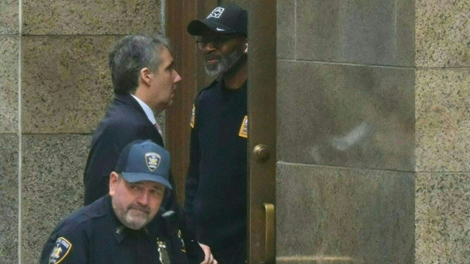 Former Trump attorney Michael Cohen (L) arrives at Manhattan Criminal Court for the trial of former US President Donald Trump for allegedly covering up hush money payments linked to extramarital affairs in New York City, on May 13, 2024. Donald Trump's criminal trial in New York was expected to hear his former lawyer turned tormentor Michael Cohen testify Monday about his role in what prosecutors say was a cover up of payments to hide an affair. (Photo by ANGELA WEISS / AFP) (Photo by ANGELA WEISS/AFP via Getty Images)