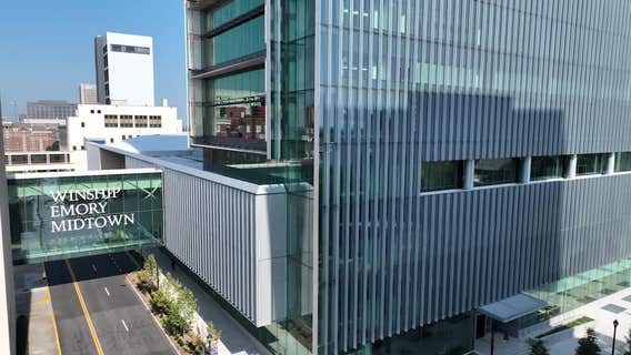 Lawsuit says Emory illegally cut 540 finance workers; Emory disputes number