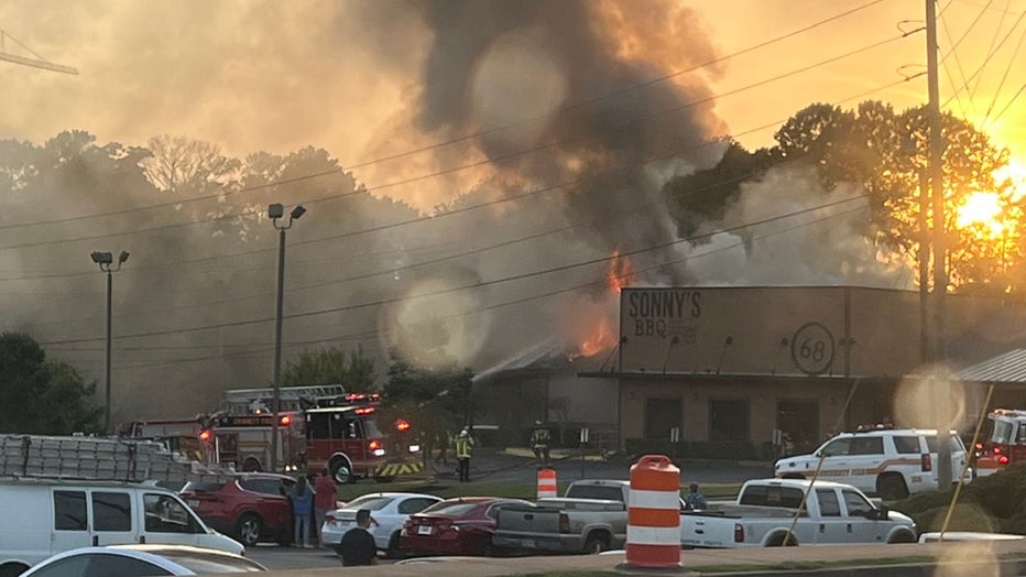 Gwinnett County firefighters battle a blaze at the Sonnys BBQ in Lawrenceville on June 4, 2024.