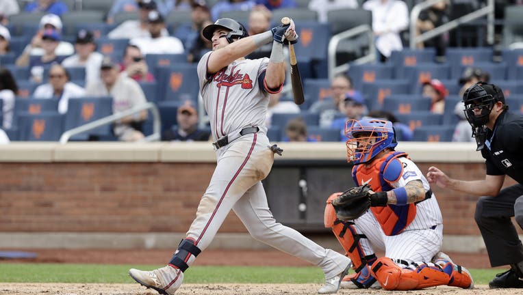 Austin Riley #27 of the Atlanta Braves follows through on his seventh inning two run home run against the New York Mets at Citi Field on July 28, 2024 in New York City. (Photo by Jim McIsaac/Getty Images)