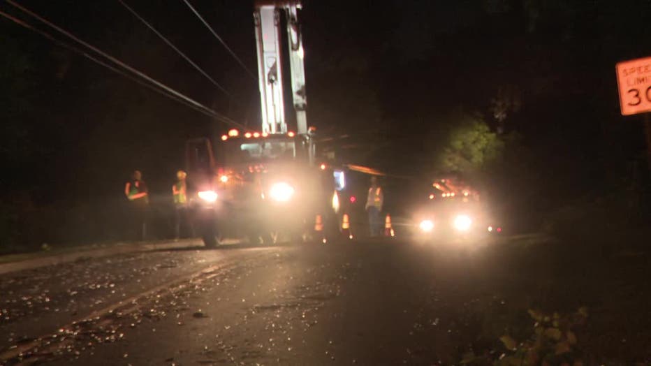 Power crews work to restore power after several trees were down along Melody Mizer Lane in Forsyth County on July 30, 2024.