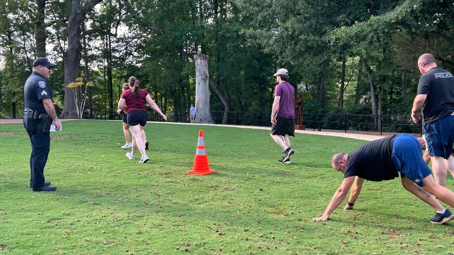 The Woodstock Police Department hold a Fit for Duty workout session at the Woodstock Arts Event Green on July 25, 2024.