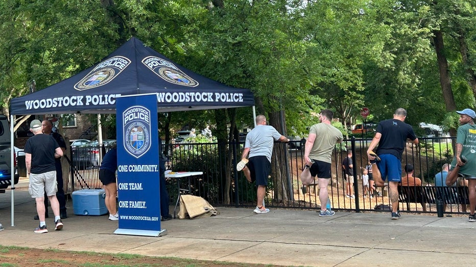 The Woodstock Police Department hold a Fit for Duty workout session at the Woodstock Arts Event Green on July 25, 2024.