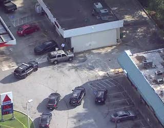 Police investigate a shooting at a gas station along Columbia Drive near I-20 in DeKalb County on Aug. 13, 2024.