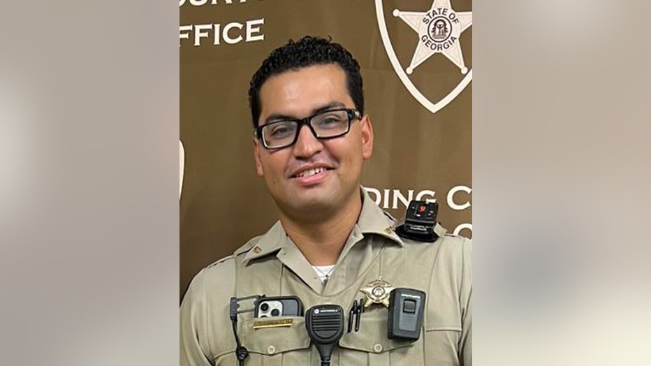 Paulding County Sheriff’s Deputy Brandon Cunningham poses for a photo after winning a raffle supporting Paulding Cops for Kids, Inc. Christmas shopping program in a photo posted to the agencies Facebook page on Aug. 10, 2023. 