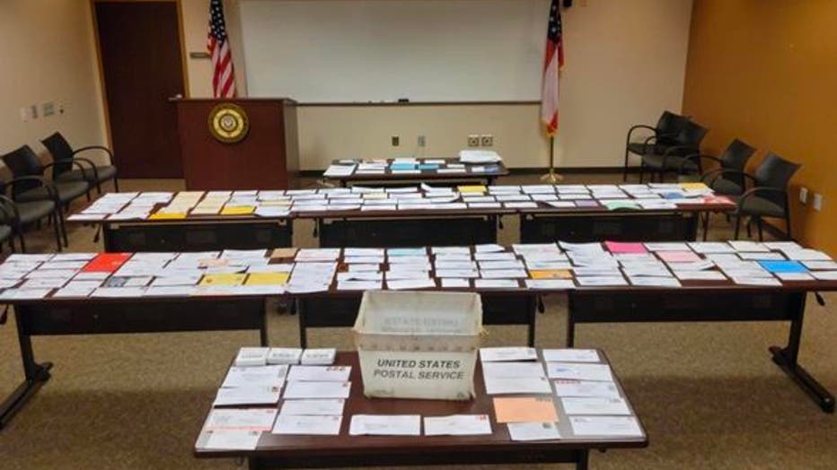 The Fayette County Sheriff's Office shows off the stolen mail seized during a covert operation on June 30, 2023.