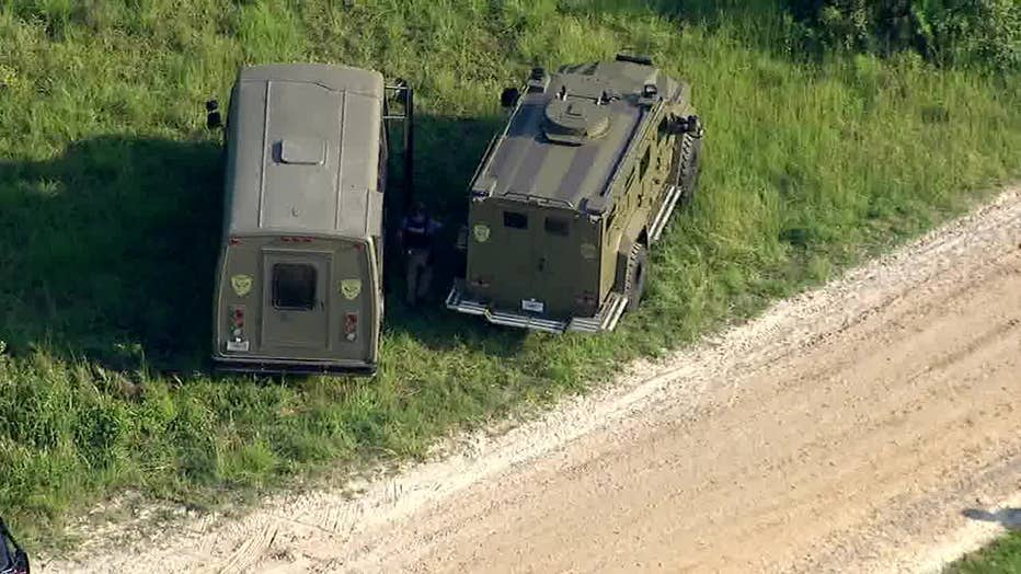 Law enforcement officials swarm the area of Old Jones Road and Acorn Creek Road in Whitesburg searching for a man who fired at deputies on Aug. 22, 2024.