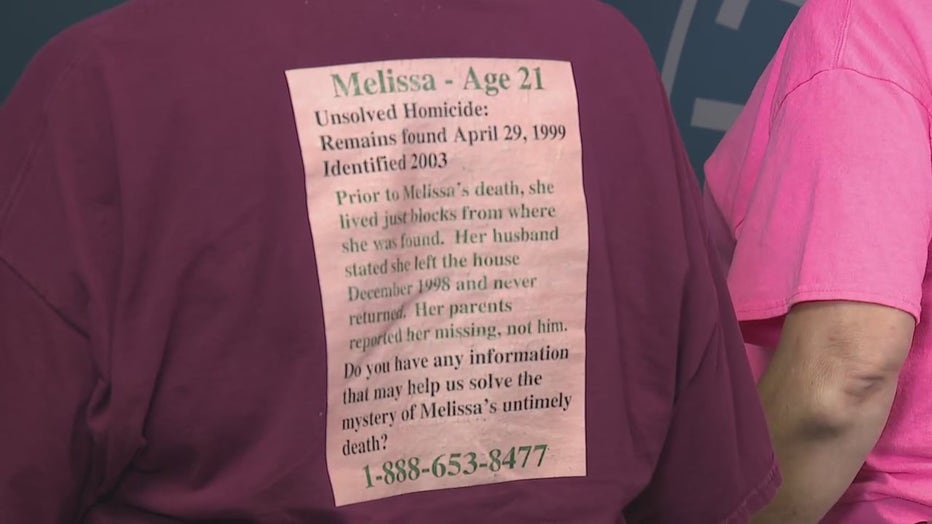 A family member of Melissa Wolfenbarger wears a T-shirt to honor the 21-year-old, who was killed in 1999, during a press conference announcing an arrest in Atlanta on Aug. 7, 2024.