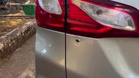 Woman narrowly escapes injury as bullet pierces car amid drag racing chaos