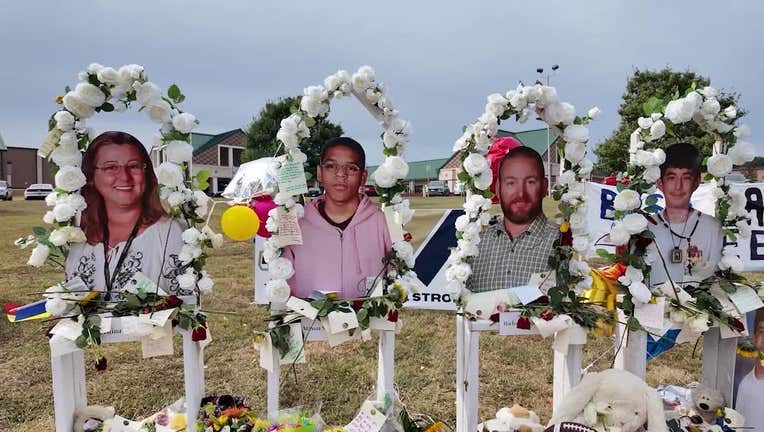 A memorial for Cristina Irimie, Mason Schermerhorn, Richard Aspinwall and Christian Angulo in front of Apalachee High School in Winder.