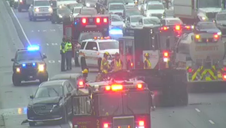 A vehicle rollover crash blocks I-85 South near the Lawrenceville-Suwanee Road exit on Sept. 12, 2024.