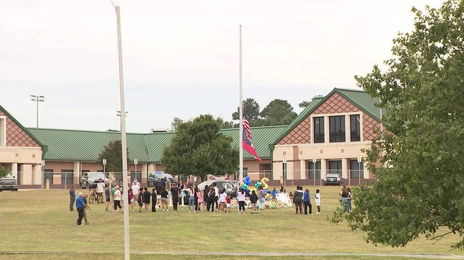 The Apalachee High School gathered to mourn those killed in Wednesday's attack, pray for those who were injured, and try come to grips with the atrocity at a makeshift memorial in front of the Winder school on Sept. 6, 2024. 