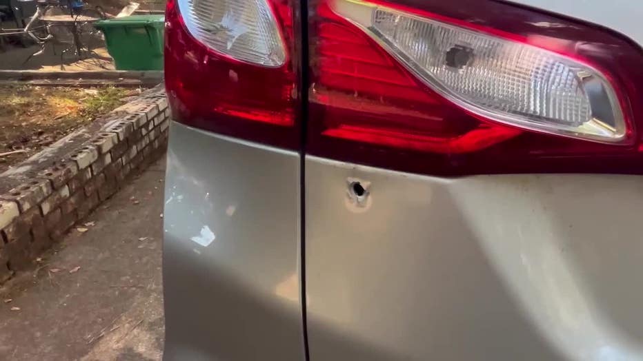 A bullet tore into a DeKalb County woman’s SUV as she tried to avoid a massive street takeover near the intersection of Panola and Browns Mill roads.