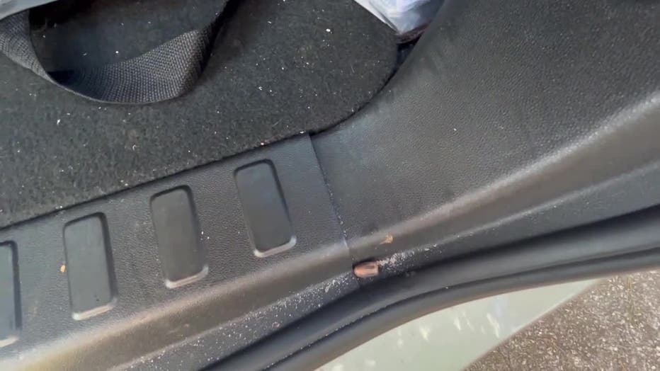 A bullet tore into a DeKalb County woman’s SUV as she tried to avoid a massive street takeover near the intersection of Panola and Browns Mill roads.