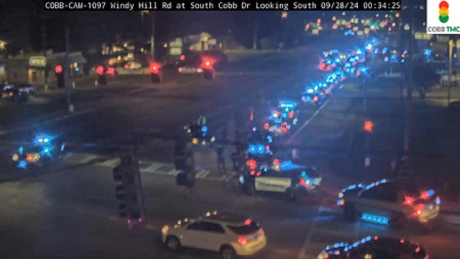 Police cars line South Cobb Drive in Windy Hill in Cobb County on September 28, 2024.