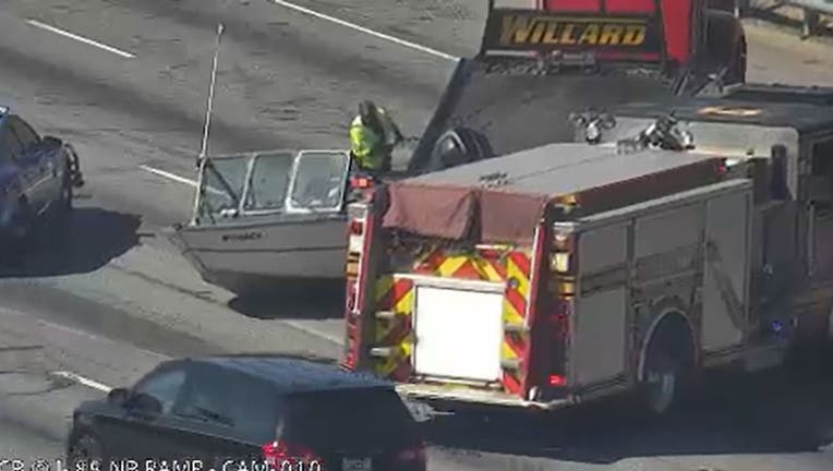 An image from a GDOT cam shows a boat in the middle of I-85 near Jimmy Carter Boulevard in Gwinnett County on Oct. 14, 2024. 