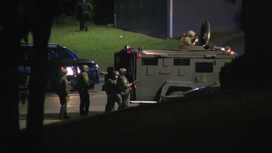 The DeKalb County SWAT team surrounds an apartment building off Candler Road on Oct. 2, 2024. 