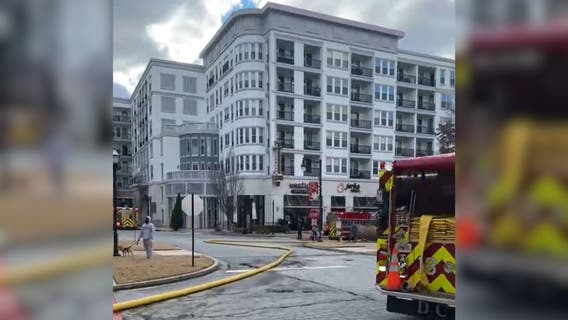 Car on fire at Town Brookhaven apartment parking deck, residents evacuated