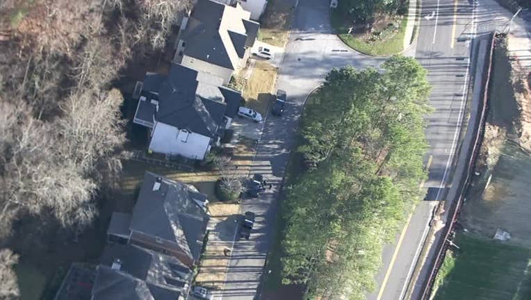 Police search the area around Dumaine Trace in Sandy Springs on Dec. 30, 2024.