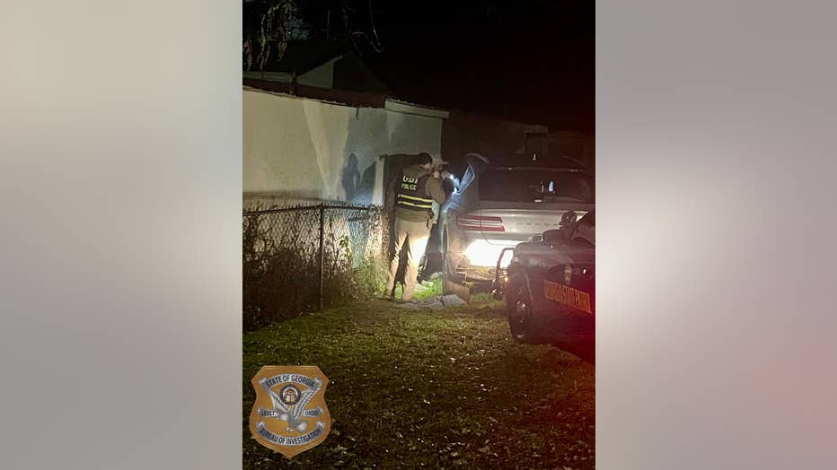 GBI investigators comb over a vehicle for clues after a shooting involving a Catoosa County deputy and a man from Chattanooga on Dec. 15, 2024.