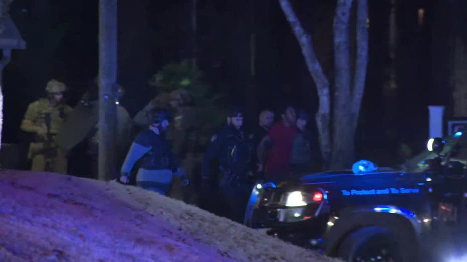 A man was seen being walked out by law enforcement from an apartment located at 666 Plaza Trace in Monroe on Dec. 25, 2024.