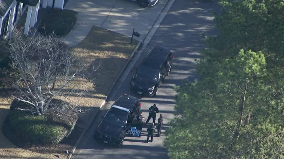 Police search the area around Dumaine Trace in Sandy Springs on Dec. 30, 2024.