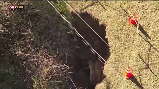 Growing yard sinkhole sparks safety concerns in DeKalb County neighborhood