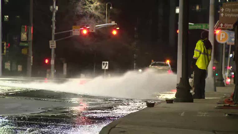 City of Atlanta Department of Watershed Management crews open a fire hydrant to help relieve pressure on a water main after a break near the Georgia State Capitol on Jan. 23, 2025.