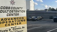 Cobb deputy's jaw broken in jail attack by murder suspect, authorities say
