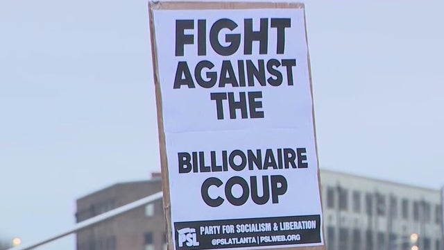 Federal workers rally Wednesday at federal building in downtown Atlanta