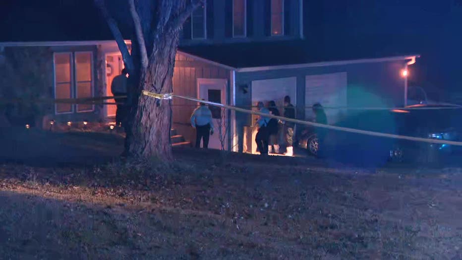 DeKalb County police surround a home where three people were shot located near the intersection of Martins Crossing Road and S. Hairston Road on Feb. 7, 2025.