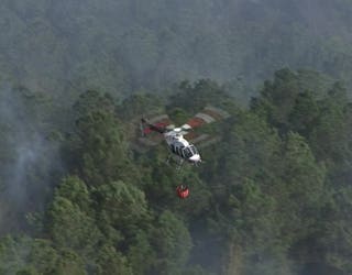 Fire crews are battling a wildfire along Cartersville Highway near Rome on March 25, 2025.