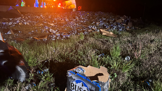 Semi-truck loses its load of beer after overturning on I-285 in DeKalb County