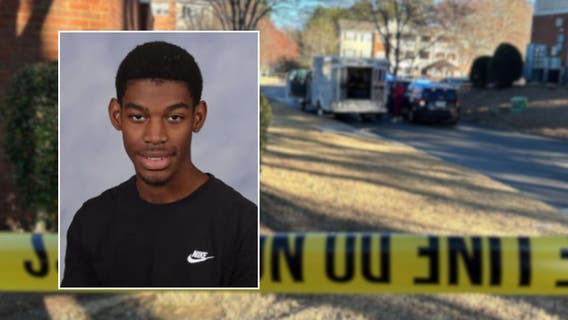 Mom with knife shot by police after allegedly stabbing son to death, officials say