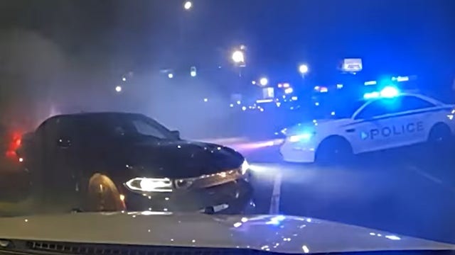 Dashcam: Driver tries to flee police in Gwinnett County parking lot