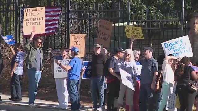 Protesters gather outside Atlanta CDC; HIV division elimination rumors