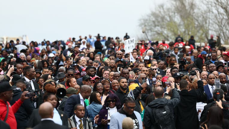 People walk across Edmund Pettus Bridge as they commemorate the 60th anniversary of "Bloody Sunday" on March 09, 2025 in Selma, Alabama